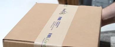 A carboard box of PAR assessments ready to be shipped